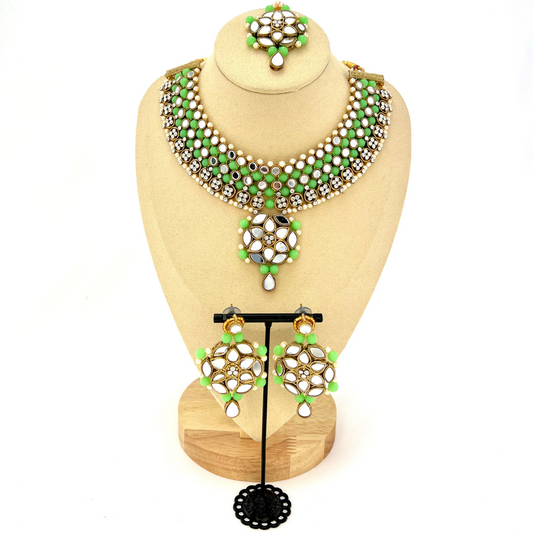 ﻿Mirror necklace set with green beads, clear stones and pearls.  Set includes, necklace, tikka and earrings.  Prefect for Indian weddings, parties and special occasions.  Latest 2022 fashion. High end Indian fashion jewellery with top quality stones and beads.