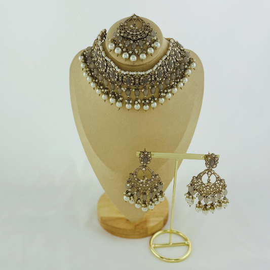 Necklace set with grey stones and white pearl beads.  Set includes necklace, tikka & earrings.  Prefect for Indian weddings, parties and special occasions.   Latest 2023 fashion. High end Indian fashion jewellery with top quality stones and beads.