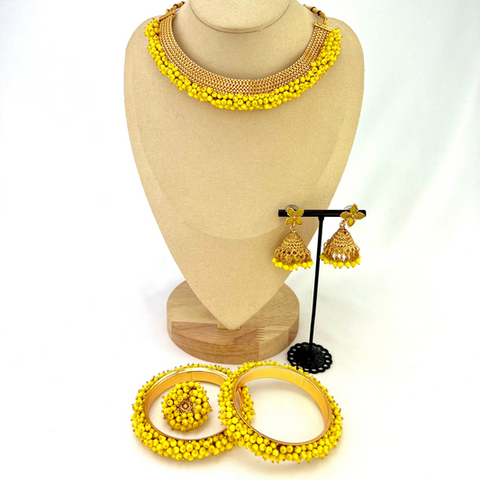 Necklace set with small yellow beads.  Set includes necklace, earrings, ring & bangle.  Prefect for Indian parties, weddings and special occasions.   Latest 2022 fashion.