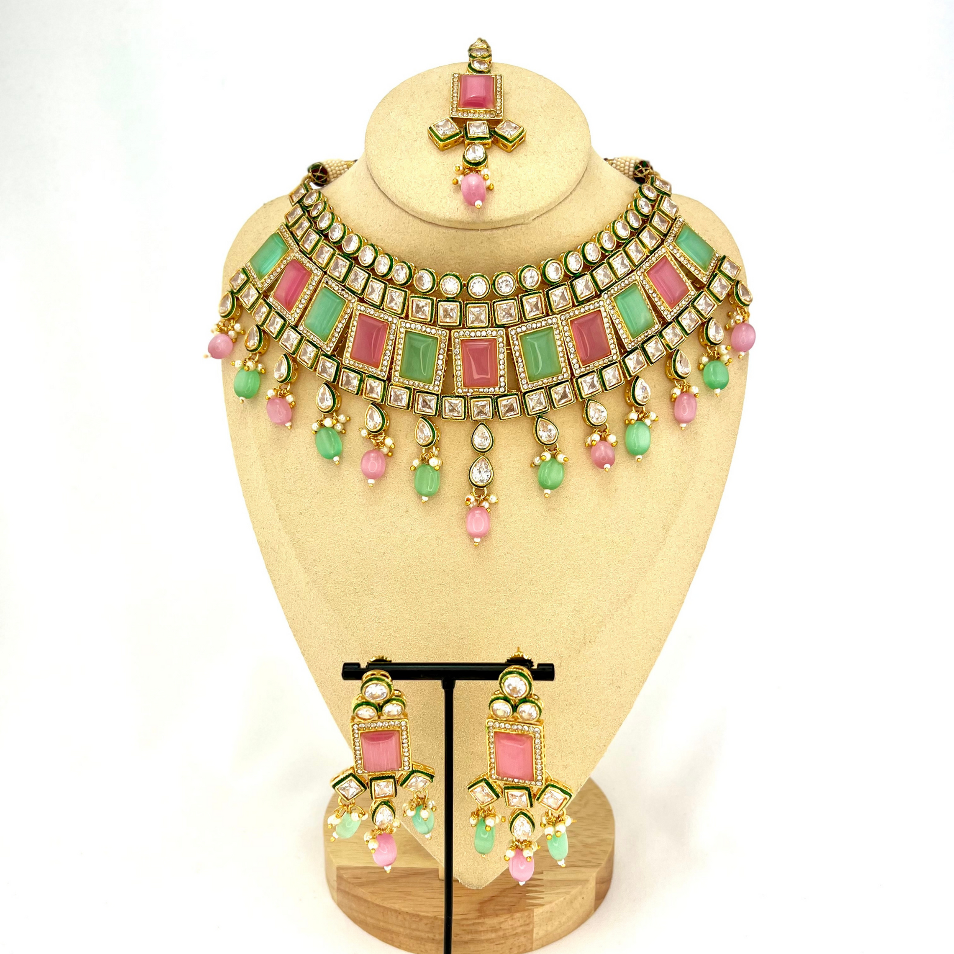 Necklace set with green, pink and clear stones and green and pink beads.  Set includes necklace, tikka and earrings.  Prefect for Indian weddings, parties and special occasions.   Latest 2022 fashion. High end Indian fashion jewellery with top quality stones and beads.