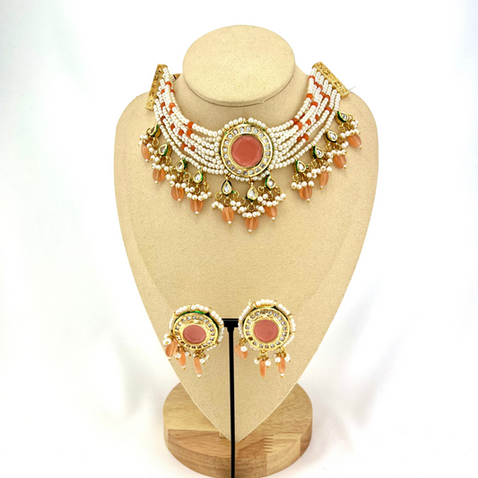 Necklace set with peach beads, stones and white pearl.  Set includes necklace and earrings.  Prefect for Indian weddings, parties and special occasions.   Latest 2022 fashion. High end Indian fashion jewellery with top quality stones and beads.