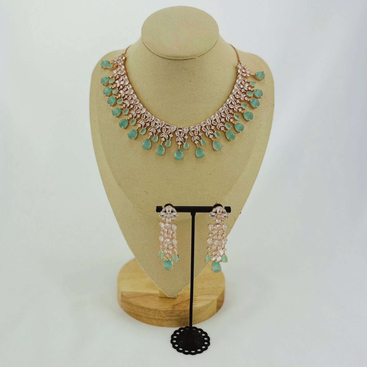 Rosegold necklace set with light blue and clear stones.  Set includes necklace & earrings.  Prefect for Indian weddings, parties and special occasions.   Latest 2023 fashion. High end Indian fashion jewellery with top quality stones and beads.