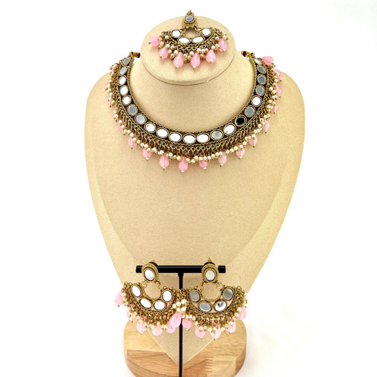 Mirror necklace set with pink beads and small white pearls.  Set includes necklace, tikka and earrings.  Prefect for Indian parties, weddings and special occasions.   Latest 2022 fashion.