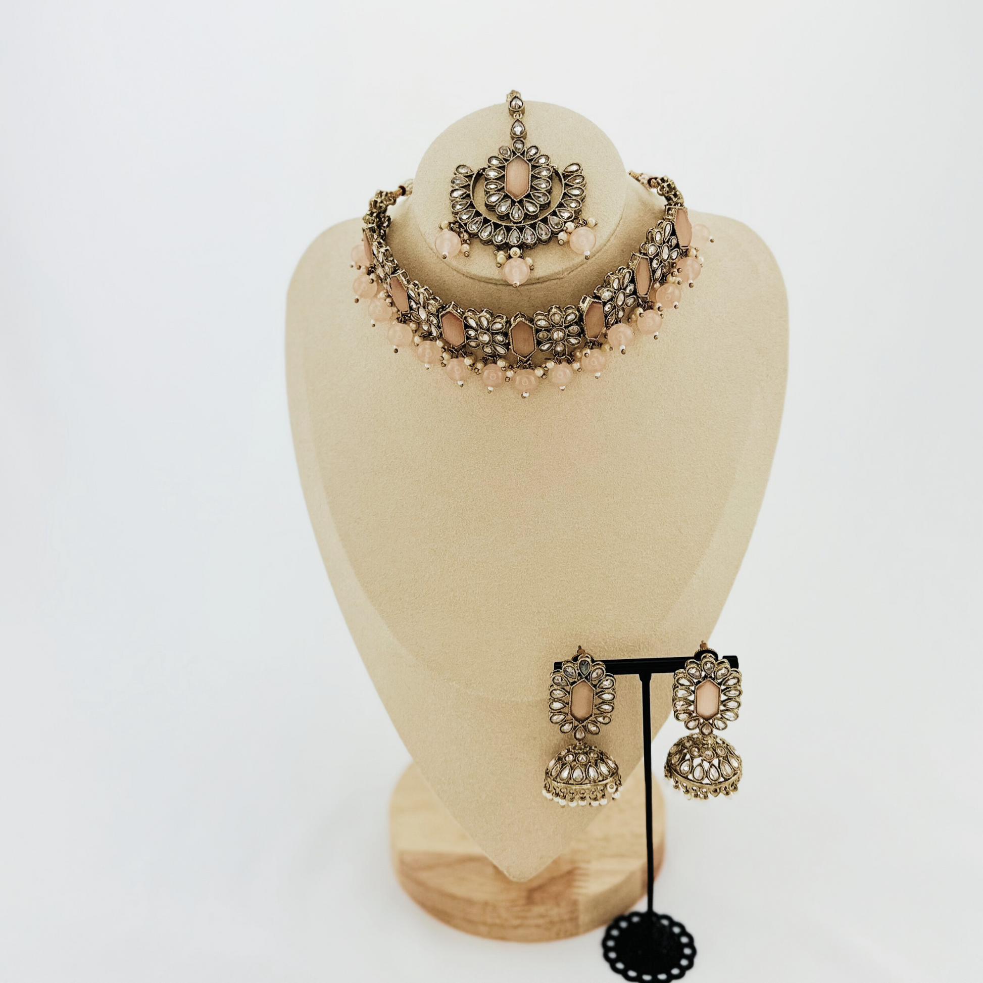 Choker set with baby pink beads and stones.  Set includes necklace, tikka & earrings.  Prefect for Indian weddings, parties and special occasions.   Latest 2023 fashion. High end Indian fashion jewellery with top quality stones and beads.