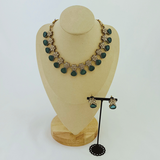 Necklace set with green stones.  Set includes necklace & earrings.  Prefect for Indian weddings, parties and special occasions.   Latest 2023 fashion. High end Indian fashion jewellery with top quality stones and beads.