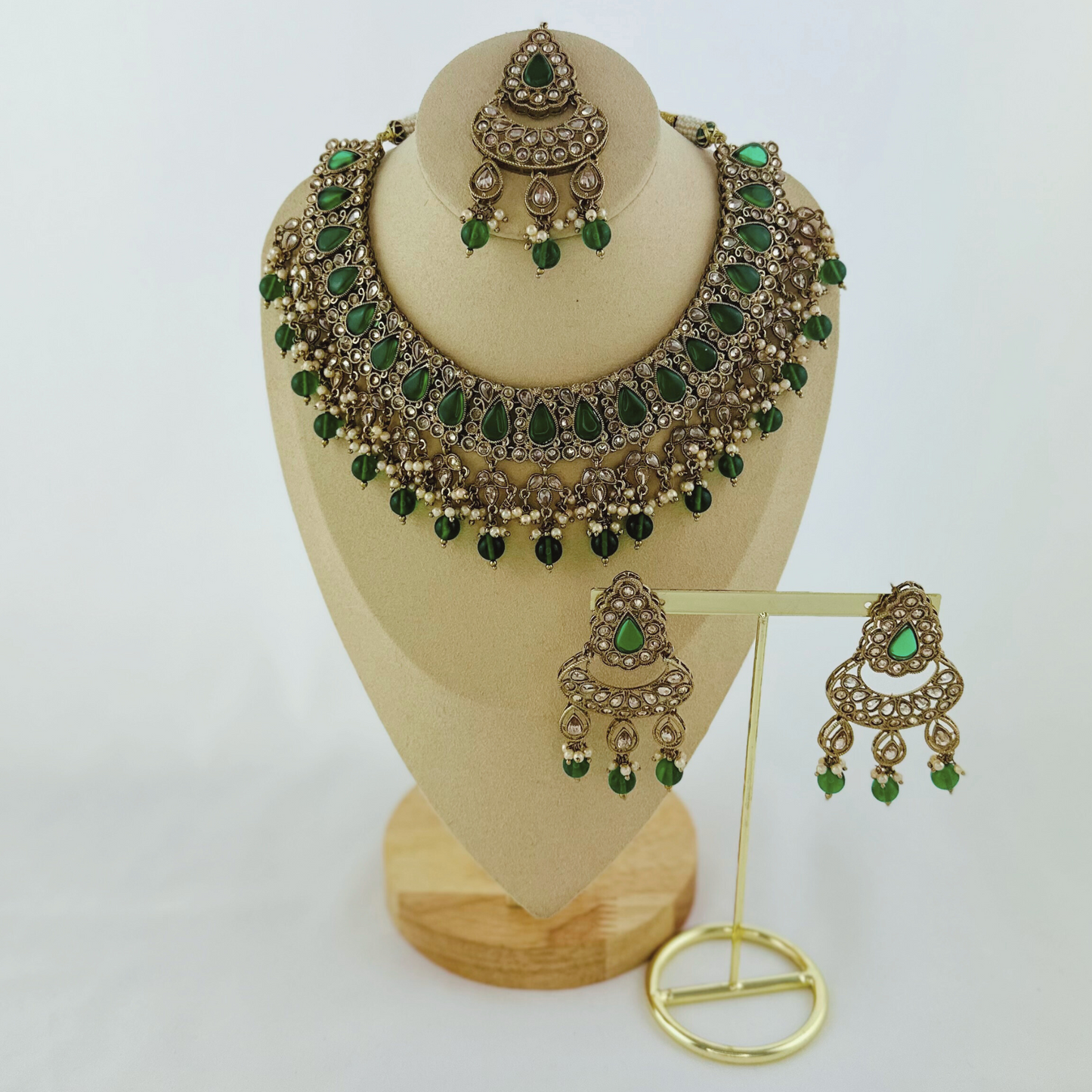 Necklace set with green beads and stone.  Set includes necklace, tikka & earrings.  Prefect for Indian weddings, parties and special occasions.   Latest 2023 fashion. High end Indian fashion jewellery with top quality stones and beads.