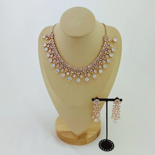 Rosegold necklace set with clear white stones.  Set includes necklace & earrings.  Prefect for Indian weddings, parties and special occasions.   Latest 2023 fashion. High end Indian fashion jewellery with top quality stones and beads.