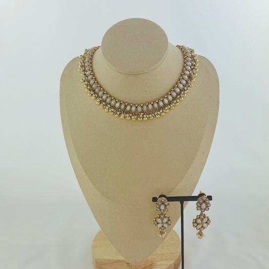 Necklace set with white pearl beads.  Set includes necklace, tikka & earrings.  Prefect for Indian weddings, parties and special occasions.   Latest 2023 fashion. High end Indian fashion jewellery with top quality stones and beads.