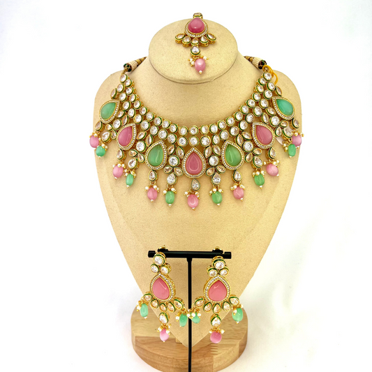 Necklace set with green, pink and clear stones and green and pink beads.  Set includes necklace, tikka and earrings.  Prefect for Indian weddings, parties and special occasions.   Latest 2022 fashion. High end Indian fashion jewellery with top quality stones and beads.