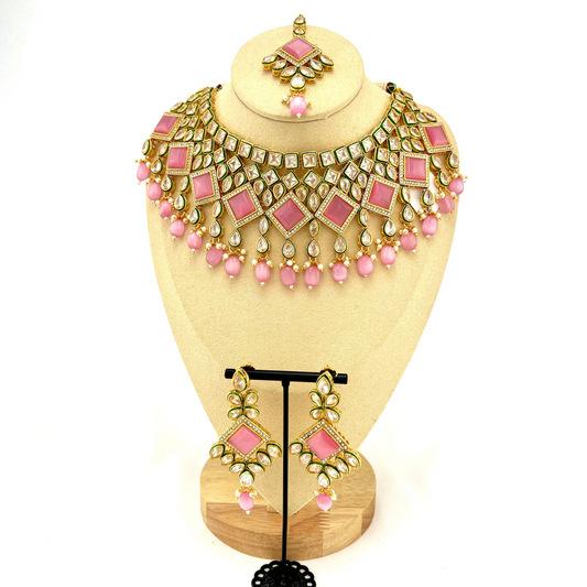 Necklace set with pink beads and pink and clear stone.  Set includes necklace, tikka & earrings.  Prefect for Indian weddings, parties and special occasions.   Latest 2022 fashion. High end Indian fashion jewellery with top quality stones and beads.