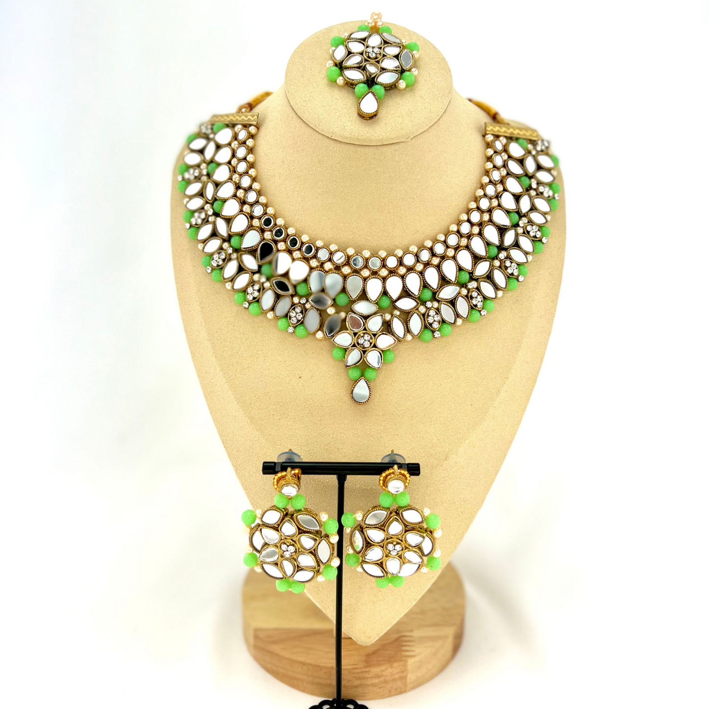 Mirror necklace set with green beads, clear stones and pearls.  Set includes, necklace, tikka and earrings.  Prefect for Indian weddings, parties and special occasions.  Latest 2022 fashion. High end Indian fashion jewellery with top quality stones and beads.