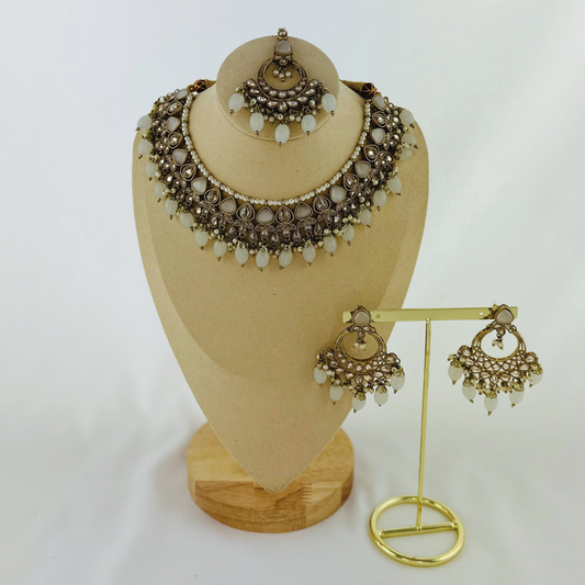 Necklace set with light grey stones and beads.  Set includes necklace, tikka & earrings.  Prefect for Indian weddings, parties and special occasions.   Latest 2023 fashion. High end Indian fashion jewellery with top quality stones and beads.