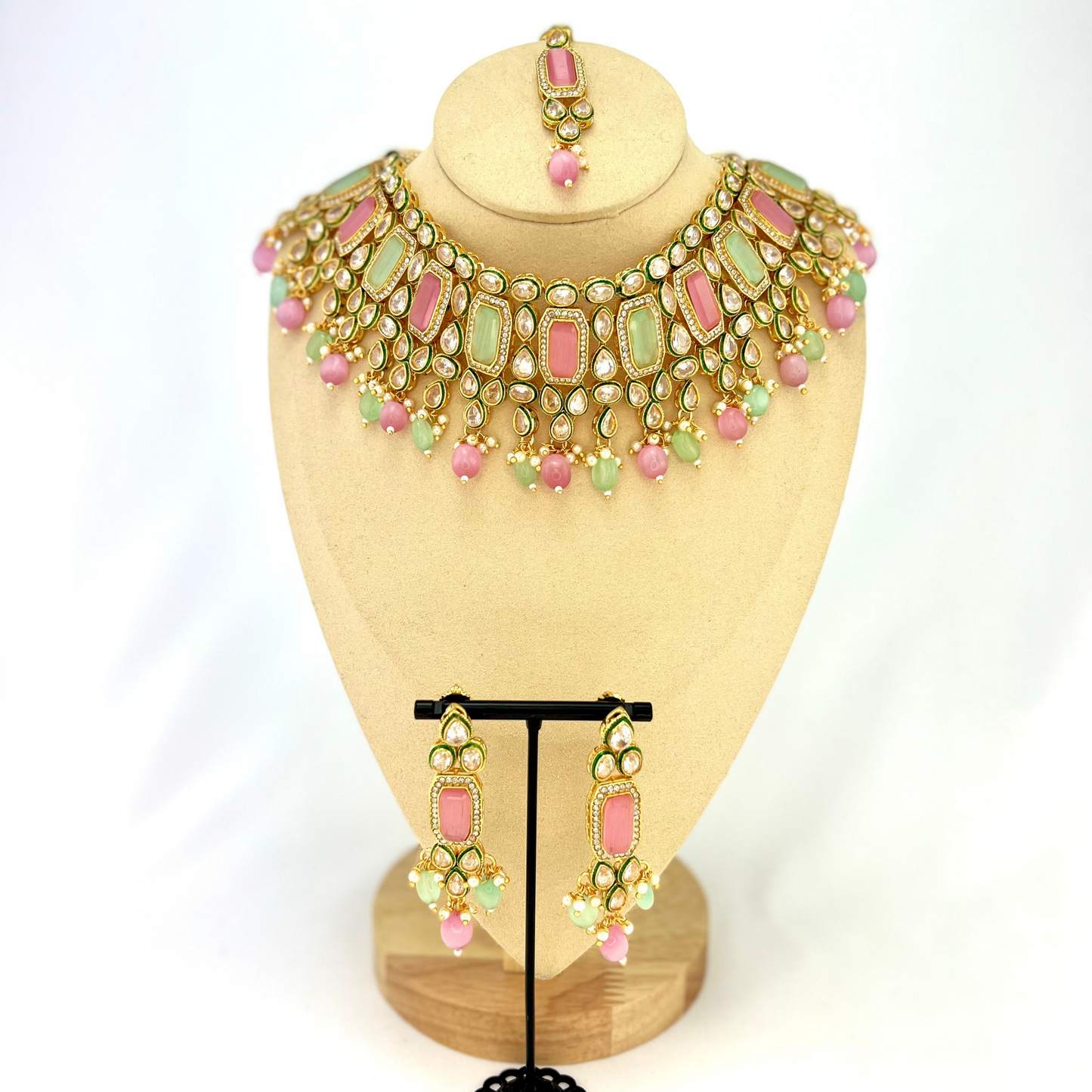 Necklace set with green, pink and clear stones and green and pink beads.  Set includes necklace, tikka and earrings.  Prefect for Indian weddings, parties and special occasions.   Latest 2022 fashion. High end Indian fashion jewellery with top quality stones and beads.