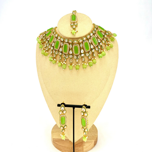 Necklace set with mint green beads and clear and mint green stones.  Set includes necklace, tikka and earrings.  Prefect for Indian weddings, parties and special occasions.  Latest 2022 fashion. High end Indian fashion jewellery with top quality stones and beads.