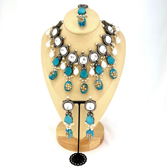 Kundan necklace set with with clear and blue stones.  Set includes necklace, tikka and earrings.  Prefect for Indian weddings, parties and special occasions.  Latest 2022 fashion. High end Indian fashion jewellery with top quality stones and beads.