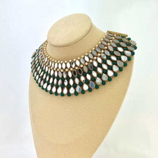 ﻿Mirror necklace set with forest green beads, clear stones and pearls.  Set includes, necklace, tikka and earrings.  Prefect for Indian weddings, parties and special occasions.  Latest 2022 fashion. High end Indian fashion jewellery with top quality stones and beads.