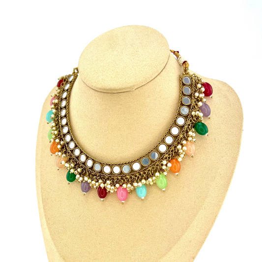 Mirror necklace set with multi colour beads and small pearls.  Set includes necklace, tikka and earrings.  Prefect for Indian parties, weddings and special occasions.   Latest 2022 fashion 