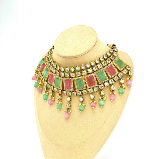 Necklace set with green, pink and clear stones and green and pink beads.  Set includes necklace, tikka and earrings.  Prefect for Indian weddings, parties and special occasions.   Latest 2022 fashion. High end Indian fashion jewellery with top quality stones and beads.