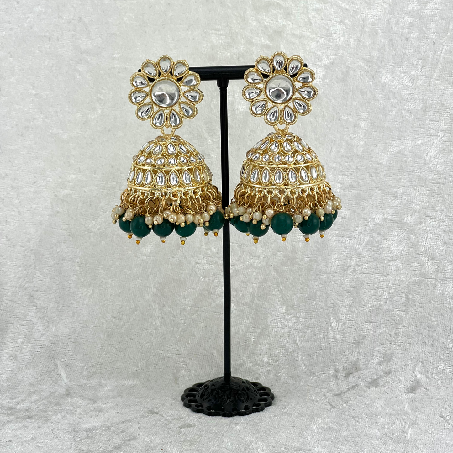 Jhumka earrings in forest green with stones, pearls and beads. Indian wedding jewellery prefect for weddings, parties and special occasions. latest high quality 2022 fashion