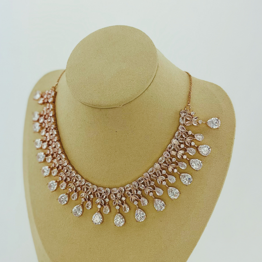 Rosegold necklace set with clear white stones.  Set includes necklace & earrings.  Prefect for Indian weddings, parties and special occasions.   Latest 2023 fashion. High end Indian fashion jewellery with top quality stones and beads.