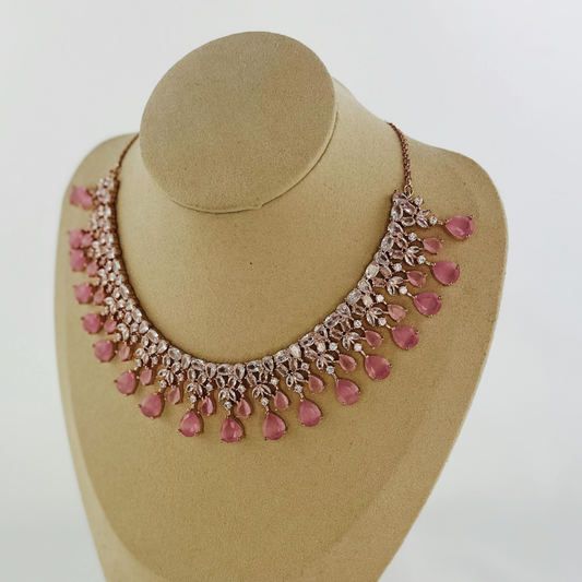 Rosegold necklace set with clear and pink stones.  Set includes necklace & earrings.  Prefect for Indian weddings, parties and special occasions.   Latest 2023 fashion. High end Indian fashion jewellery with top quality stones and beads.