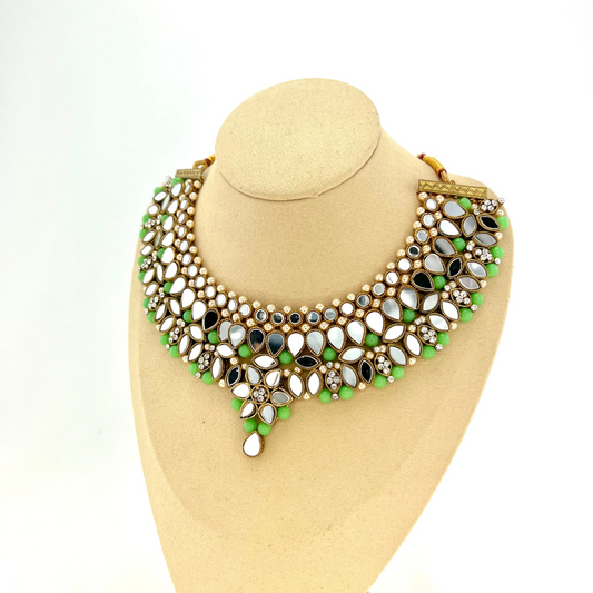 Mirror necklace set with green beads, clear stones and pearls.  Set includes, necklace, tikka and earrings.  Prefect for Indian weddings, parties and special occasions.  Latest 2022 fashion. High end Indian fashion jewellery with top quality stones and beads.