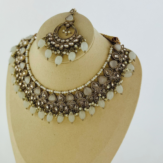 Necklace set with light grey stones and beads.  Set includes necklace, tikka & earrings.  Prefect for Indian weddings, parties and special occasions.   Latest 2023 fashion. High end Indian fashion jewellery with top quality stones and beads.