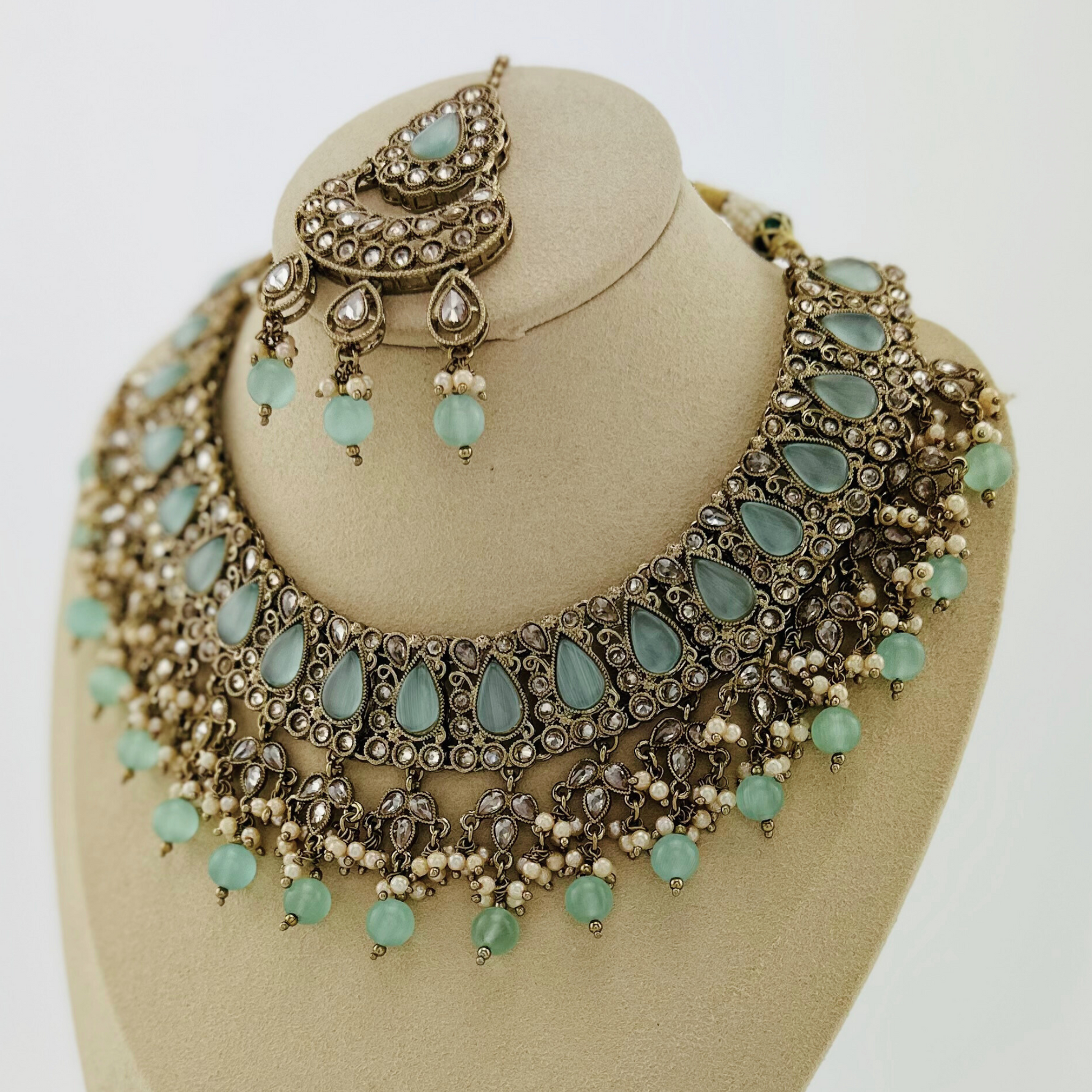 Necklace set with light blue beads and stone.  Set includes necklace, tikka & earrings.  Prefect for Indian weddings, parties and special occasions.   Latest 2023 fashion. High end Indian fashion jewellery with top quality stones and beads.