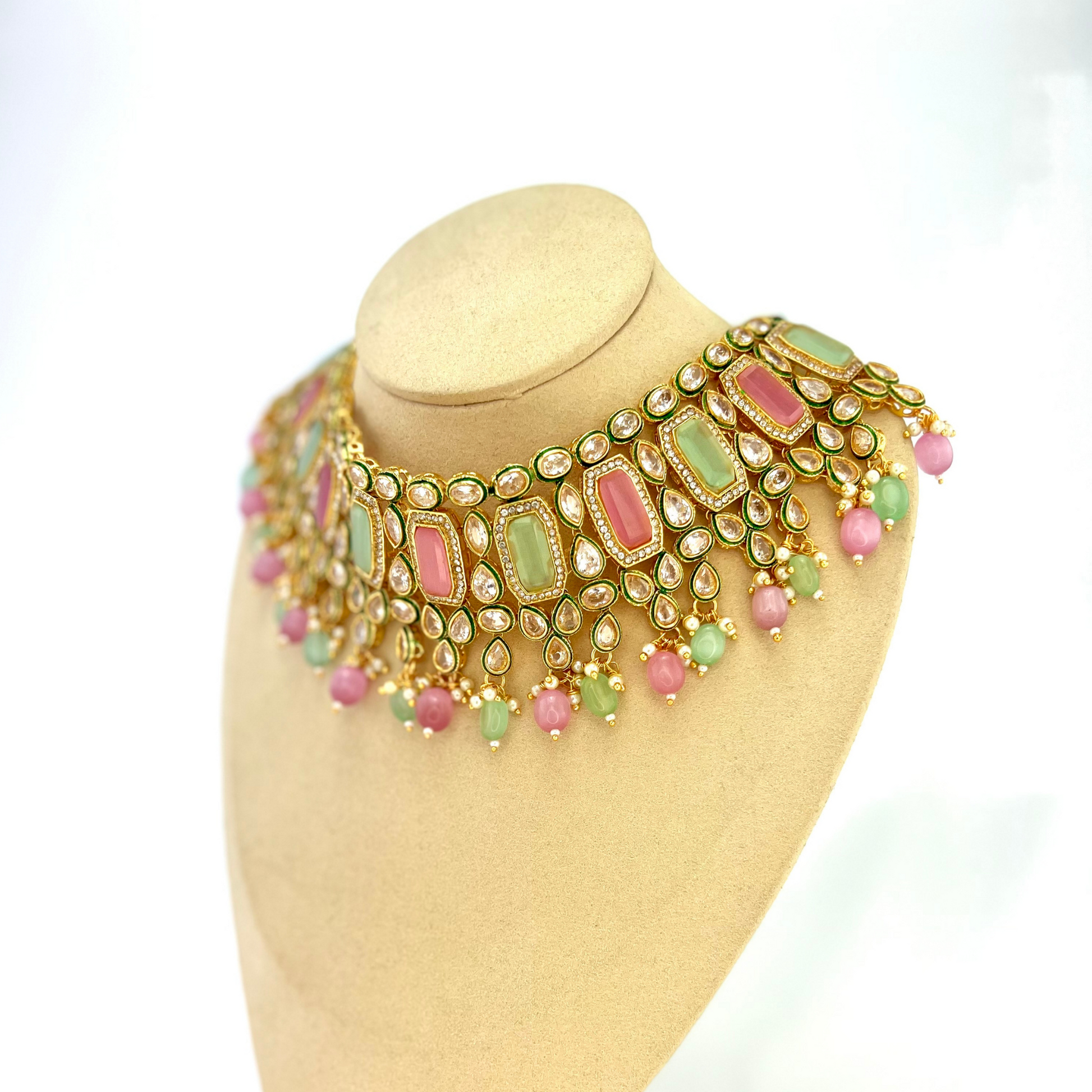 Necklace set with green, pink and clear stones and green and pink beads.  Set includes necklace, tikka and earrings.  Prefect for Indian weddings, parties and special occasions.   Latest 2022 fashion. High end Indian fashion jewellery with top quality stones and beads.