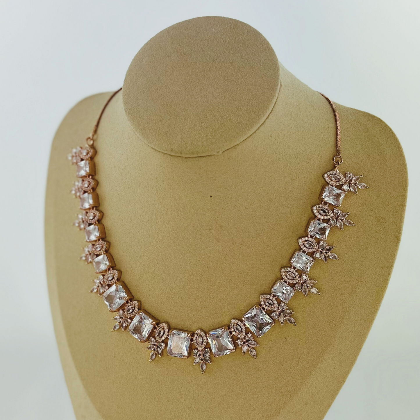 Rosegold necklace set with clear white stones.  Set includes necklace & earrings.  Prefect for Indian weddings, parties and special occasions.   Latest 2023 fashion. High end Indian fashion jewellery with top quality stones and beads.