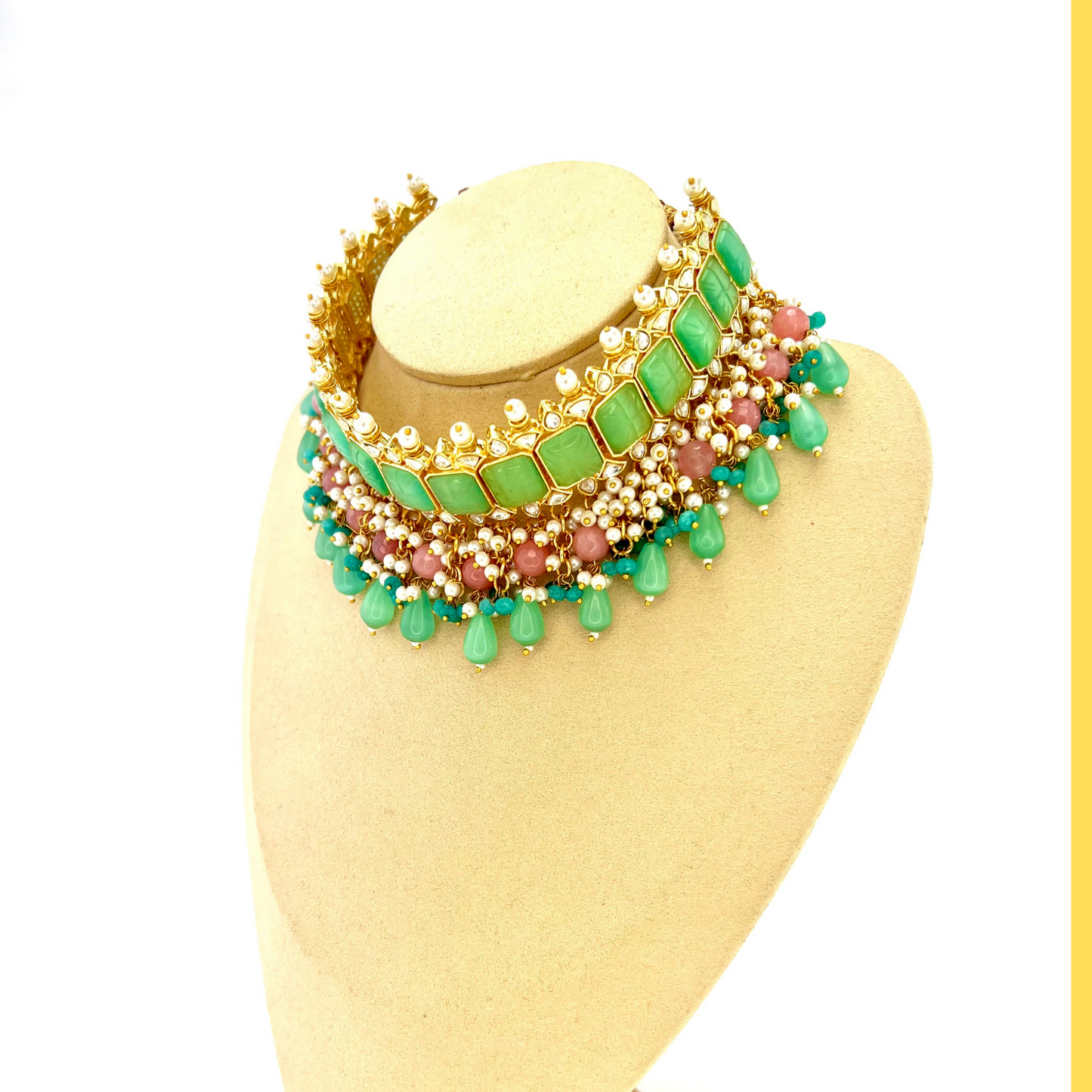 ﻿Choker set with with green, clear stones and pink and blue beads.  Set includes choker, tikka and earrings.  Prefect for Indian weddings, parties and special occasions.  Latest 2022 fashion. High end Indian fashion jewellery with top quality stones and beads.