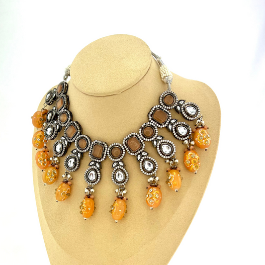 Kundan necklace set with peach and clear stone work.  Set includes necklace and earrings.  Prefect for Indian weddings, parties and special occasions.  Latest 2022 fashion. High end Indian fashion jewellery with top quality stones and beads.