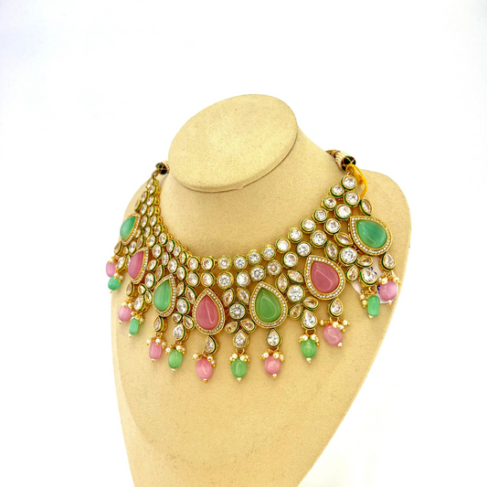 Necklace set with green, pink and clear stones and green and pink beads.  Set includes necklace, tikka and earrings.  Prefect for Indian weddings, parties and special occasions.   Latest 2022 fashion. High end Indian fashion jewellery with top quality stones and beads.