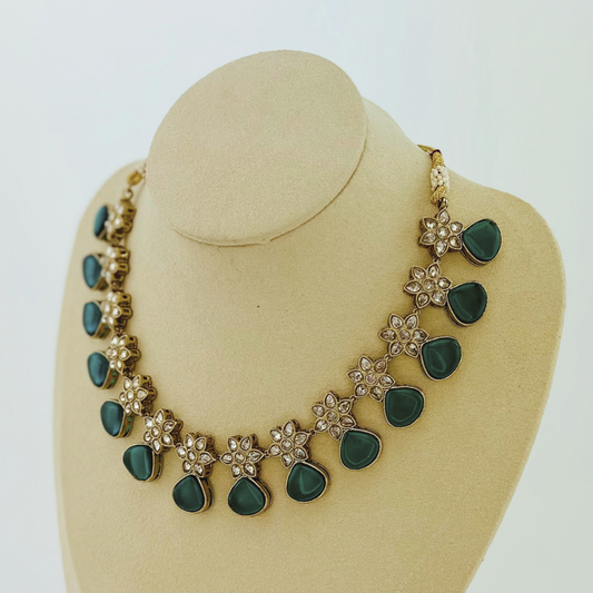 Necklace set with green stones.  Set includes necklace & earrings.  Prefect for Indian weddings, parties and special occasions.   Latest 2023 fashion. High end Indian fashion jewellery with top quality stones and beads.