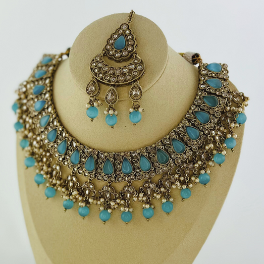 Necklace set with blue stones and beads.  Set includes necklace, tikka & earrings.  Prefect for Indian weddings, parties and special occasions.   Latest 2023 fashion. High end Indian fashion jewellery with top quality stones and beads.