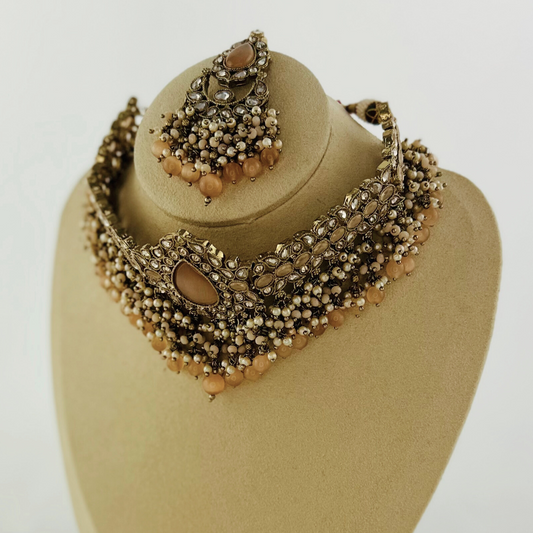 Choker set with peach beads and stones.  Set includes necklace, tikka & earrings.  Prefect for Indian weddings, parties and special occasions.   Latest 2023 fashion. High end Indian fashion jewellery with top quality stones and beads.