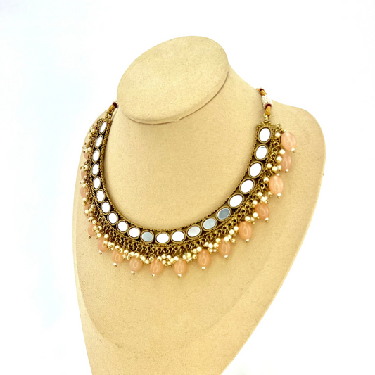 Mirror necklace set with peach beads and small white pearls.  Set includes necklace, tikka and earrings.  Prefect for Indian parties, weddings and special occasions.   Latest 2022 fashion.