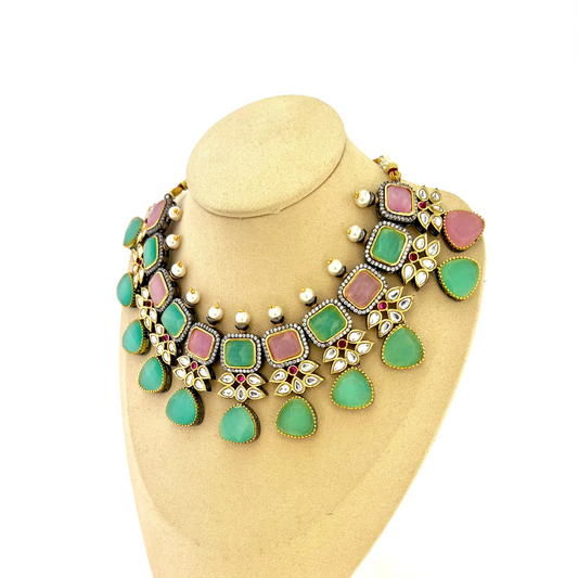 Necklace set with green, pink and silver stone work finished with small white pearls.  Set includes necklace, tikka and earrings.  Prefect for Indian parties, weddings and special occasions.   Latest 2022 fashion 