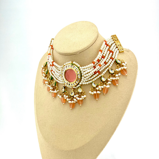 Necklace set with peach beads, stones and white pearl.  Set includes necklace and earrings.  Prefect for Indian weddings, parties and special occasions.   Latest 2022 fashion. High end Indian fashion jewellery with top quality stones and beads.