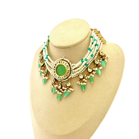 Necklace set with green beads, stones and white pearl.  Set includes necklace and earrings.  Prefect for Indian weddings, parties and special occasions.   Latest 2022 fashion. High end Indian fashion jewellery with top quality stones and beads.