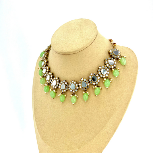 Mirror Necklace set with green beads.   Set includes necklace, tikka and earrings.  Prefect for Indian parties, weddings and special occasions.   Latest 2022 fashion 