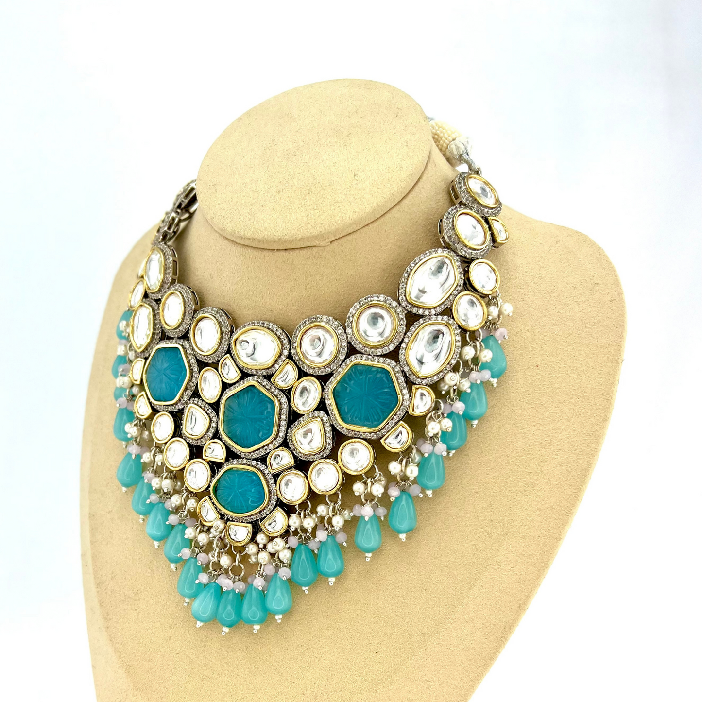 Kundan necklace set with with clear and blue stones, blue beads and small white pearls.  Set includes necklace and earrings.  Prefect for Indian weddings, parties and special occasions.  Latest 2022 fashion. High end Indian fashion jewellery with top quality stones and beads.