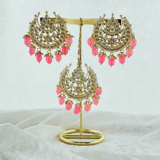 Tikka & earring set in pink.  High quality beads, pearls and stone work.   Latest 2023 fashion for weddings, parties and special occasions 