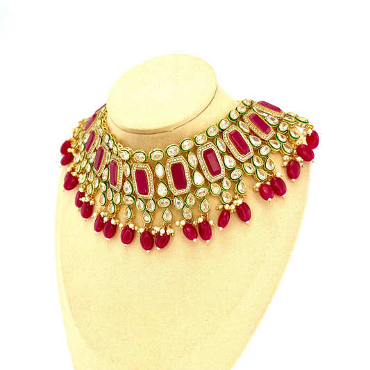 Necklace set with hot pink beads and clear and hot pink stones.  Set includes necklace, tikka and earrings.  Prefect for Indian weddings, parties and special occasions.  Latest 2022 fashion. High end Indian fashion jewellery with top quality stones and beads.