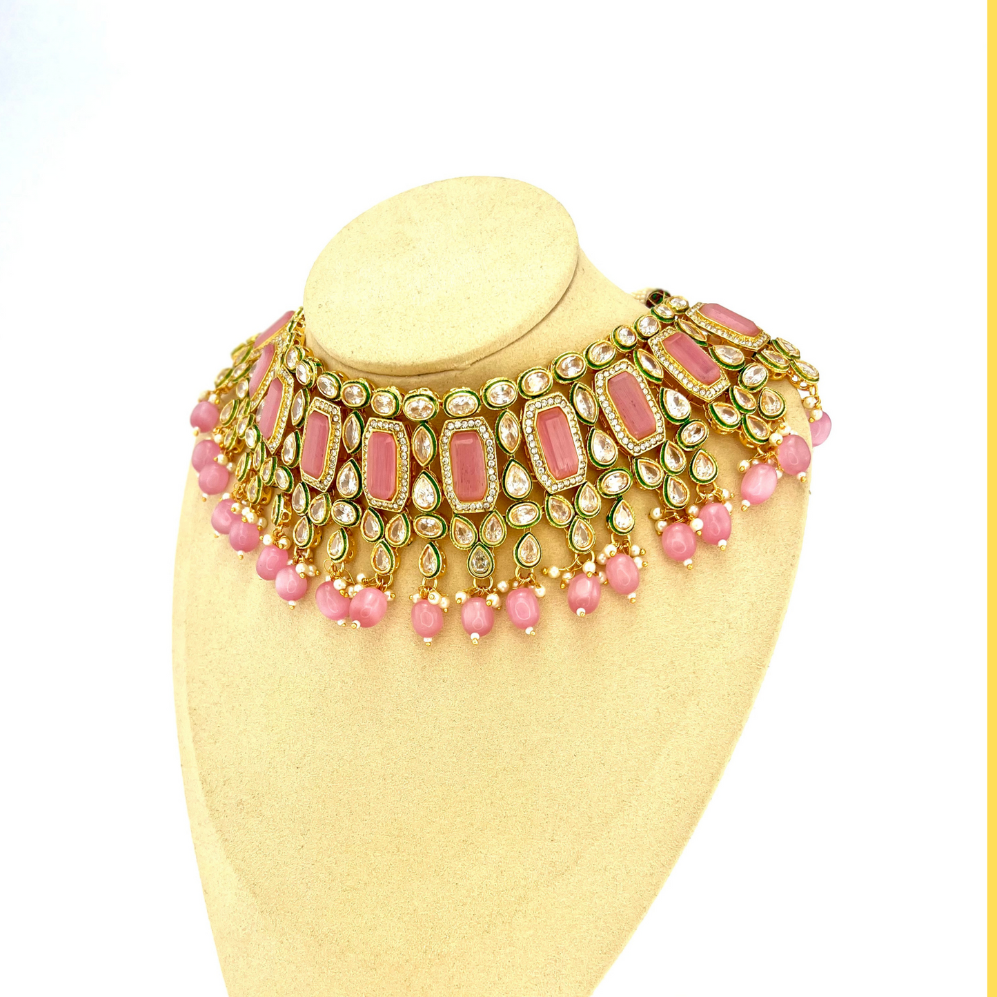 Necklace set with pink beads and clear and pink stones.  Set includes necklace, tikka and earrings.  Prefect for Indian weddings, parties and special occasions.  Latest 2022 fashion. High end Indian fashion jewellery with top quality stones and beads.