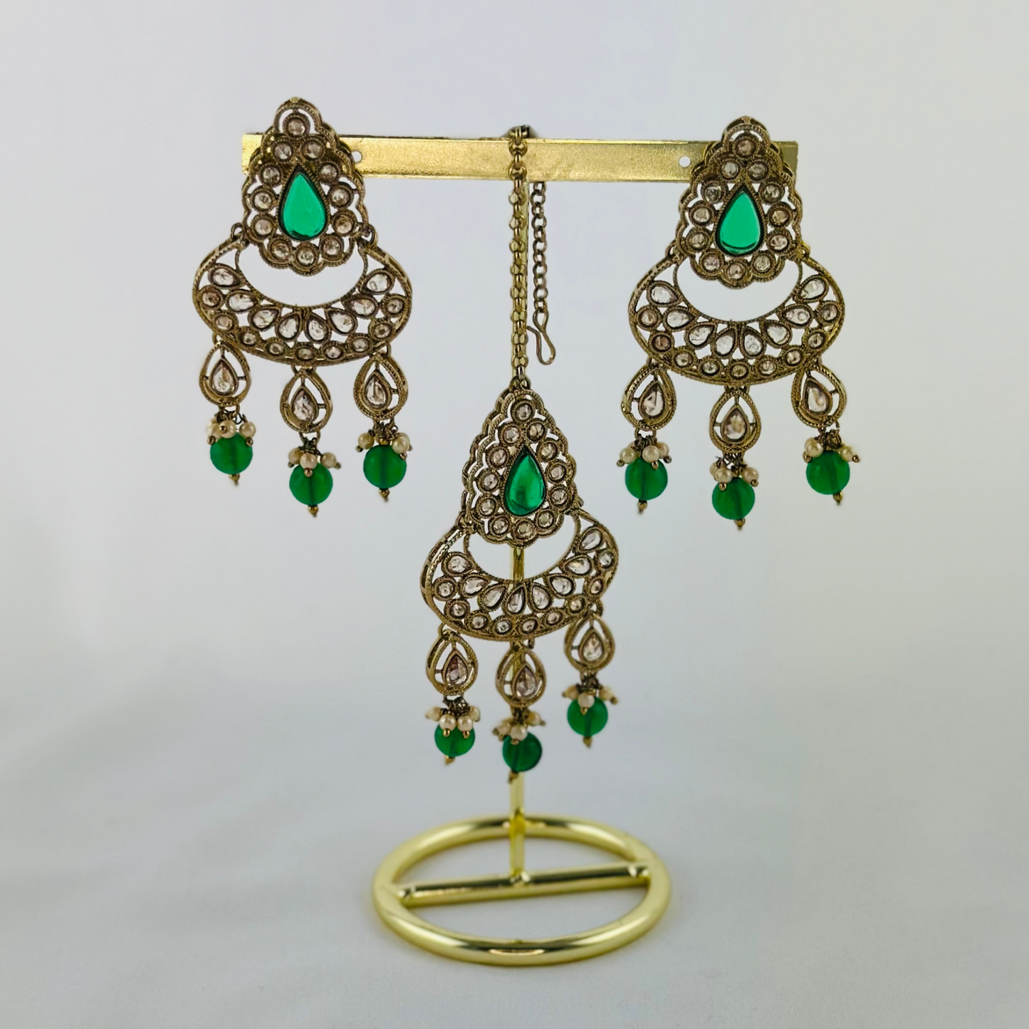 Necklace set with green beads and stone.  Set includes necklace, tikka & earrings.  Prefect for Indian weddings, parties and special occasions.   Latest 2023 fashion. High end Indian fashion jewellery with top quality stones and beads.