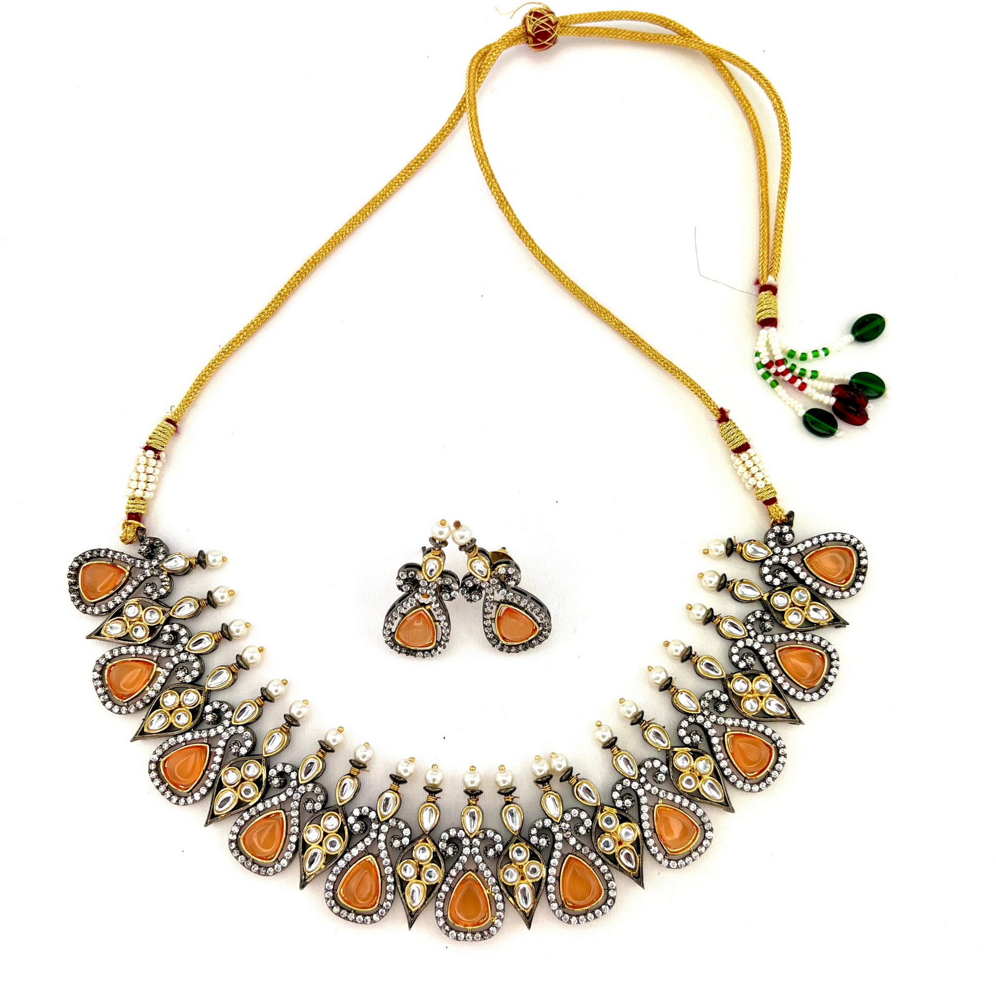 Necklace set with peach and clear stone work.  Set includes necklace and earrings.  Prefect for Indian weddings, parties and special occasions.  Latest 2022 fashion. High end Indian fashion jewellery with top quality stones and beads.