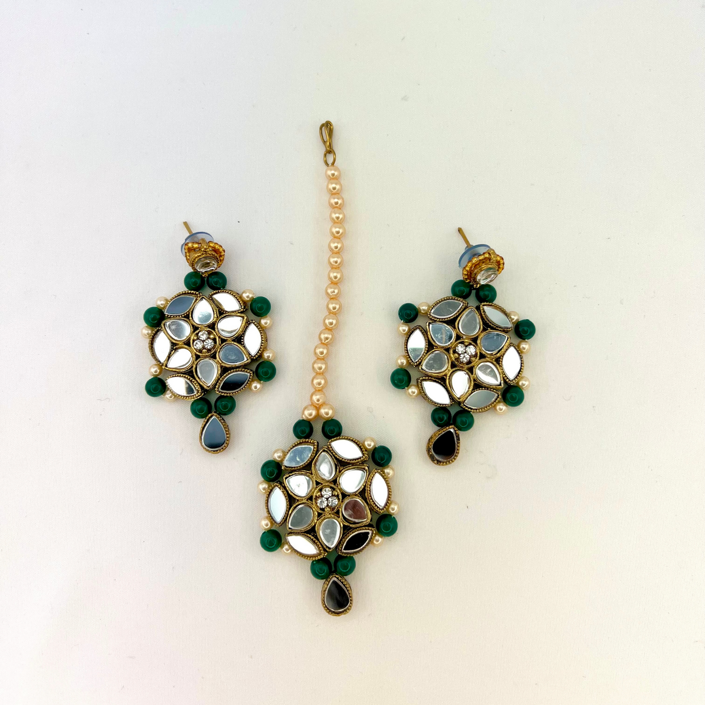 Mirror necklace set with forest green beads, clear stones and pearls.  Set includes, necklace, tikka and earrings.  Prefect for Indian weddings, parties and special occasions.  Latest 2022 fashion. High end Indian fashion jewellery with top quality stones and beads.