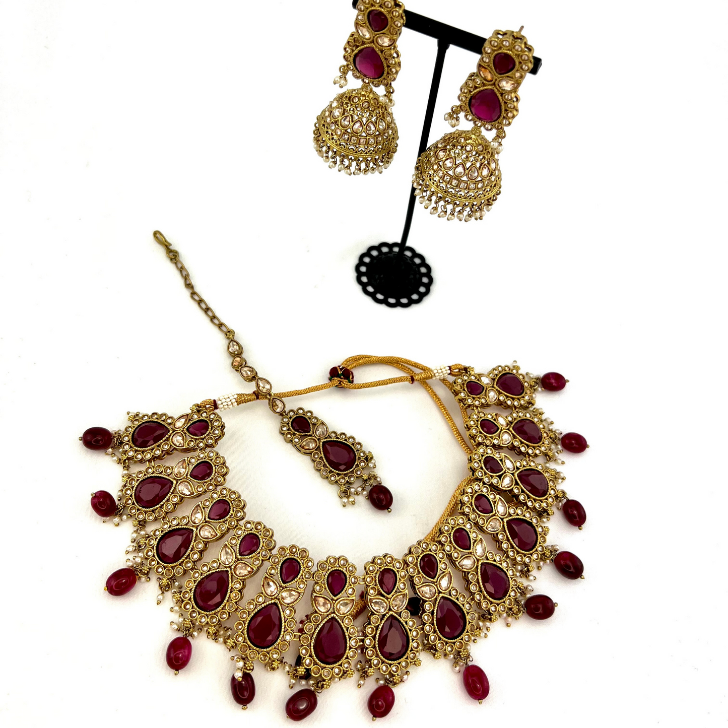 ﻿Necklace set with maroon and gold stone work and maroon beads.  Set includes necklace, tikka and earrings.  Prefect for Indian weddings, parties and special occasions.  Latest 2022 fashion. High end Indian fashion jewellery with top quality stones and beads.