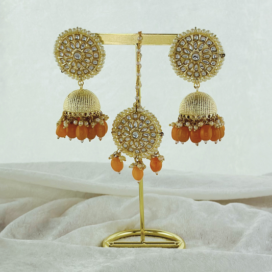 Tikka & earring set in peach.  High quality beads, pearls and stone work.   Latest 2023 fashion for weddings, parties and special occasions 